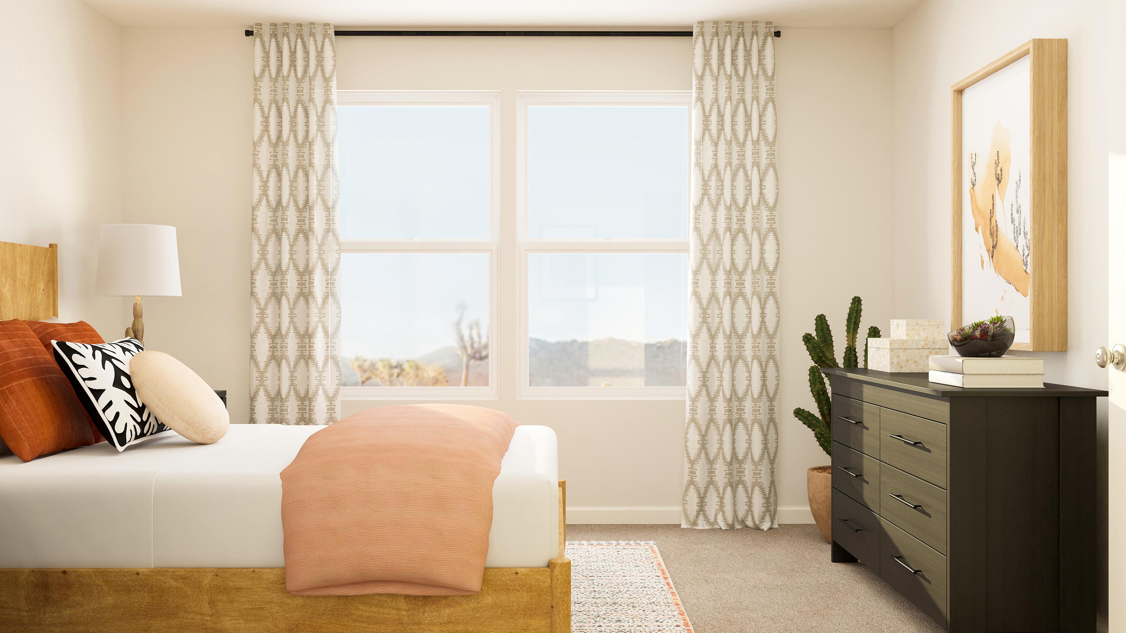 A bedroom with a bed and a chair.