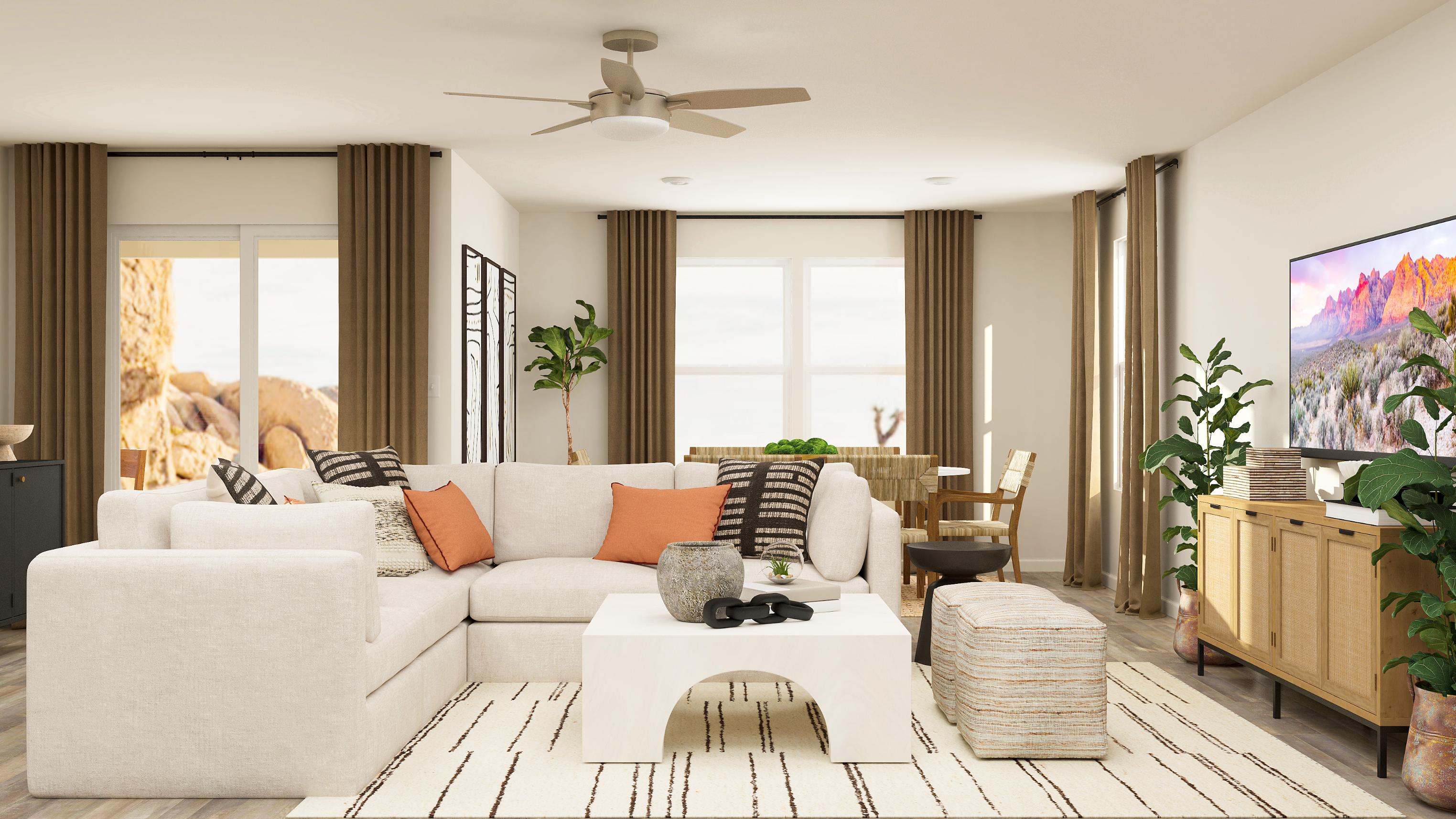A living room with a white couch and a white table.