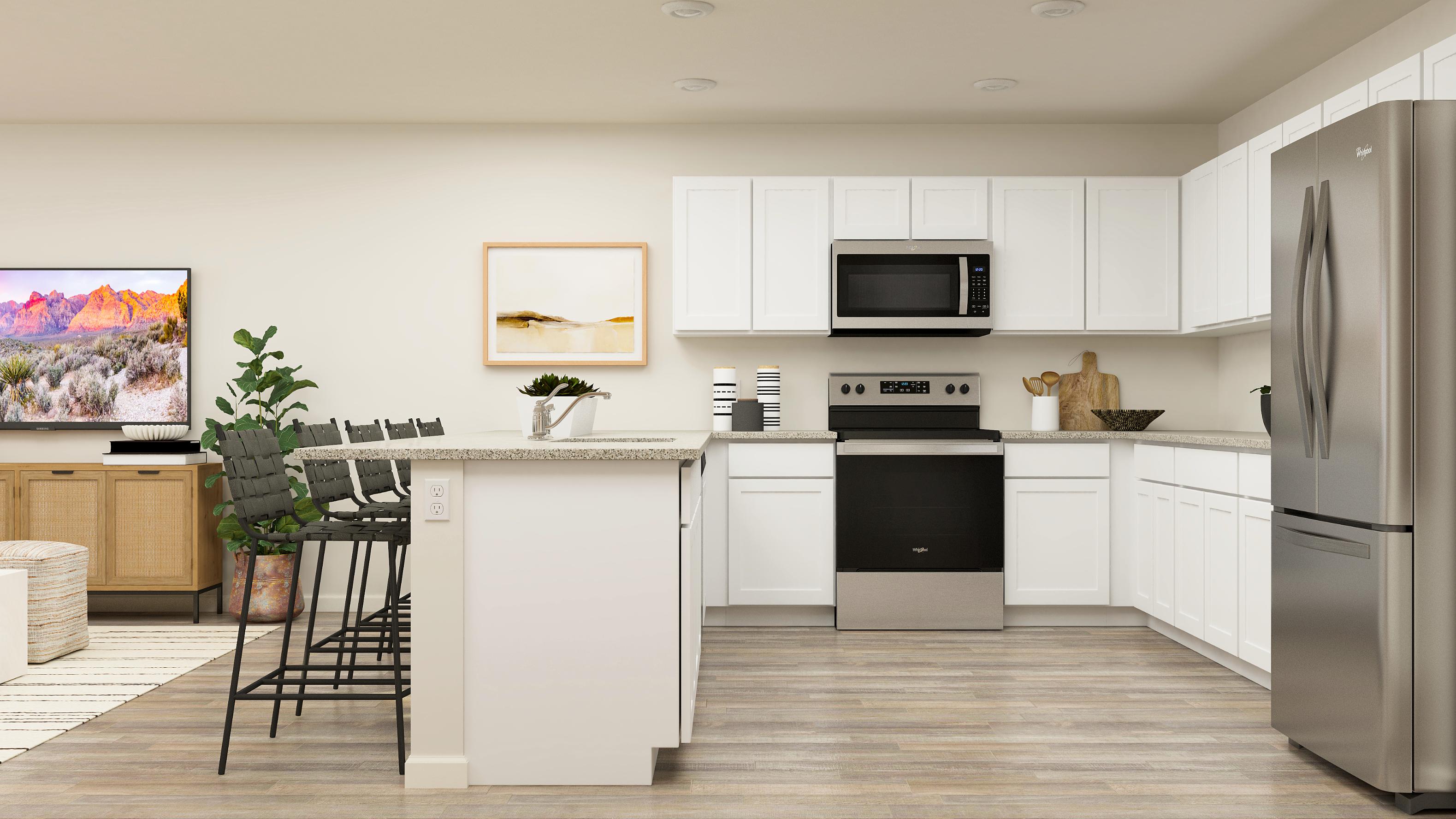 A kitchen with white cabinets.
