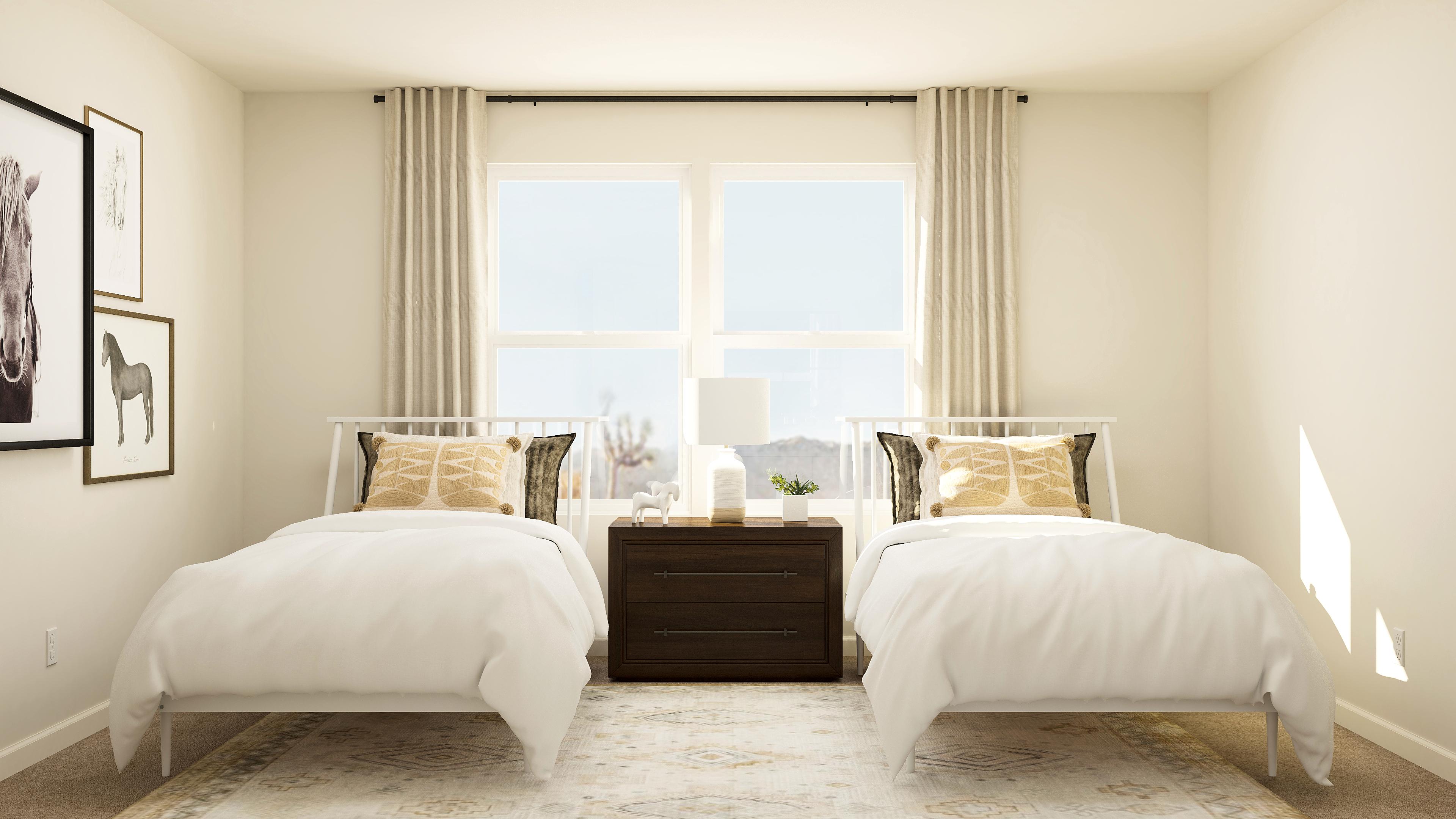 A bedroom with two beds.