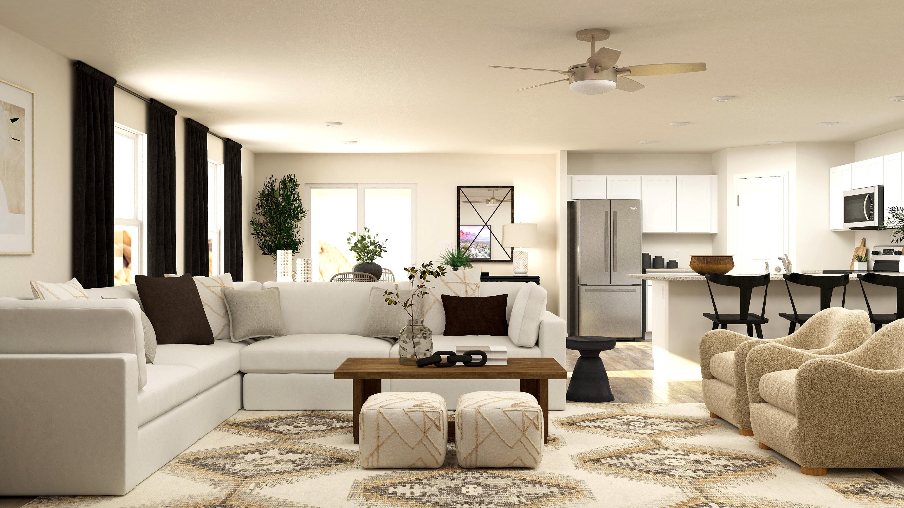 A living room with a large white couch and a table.