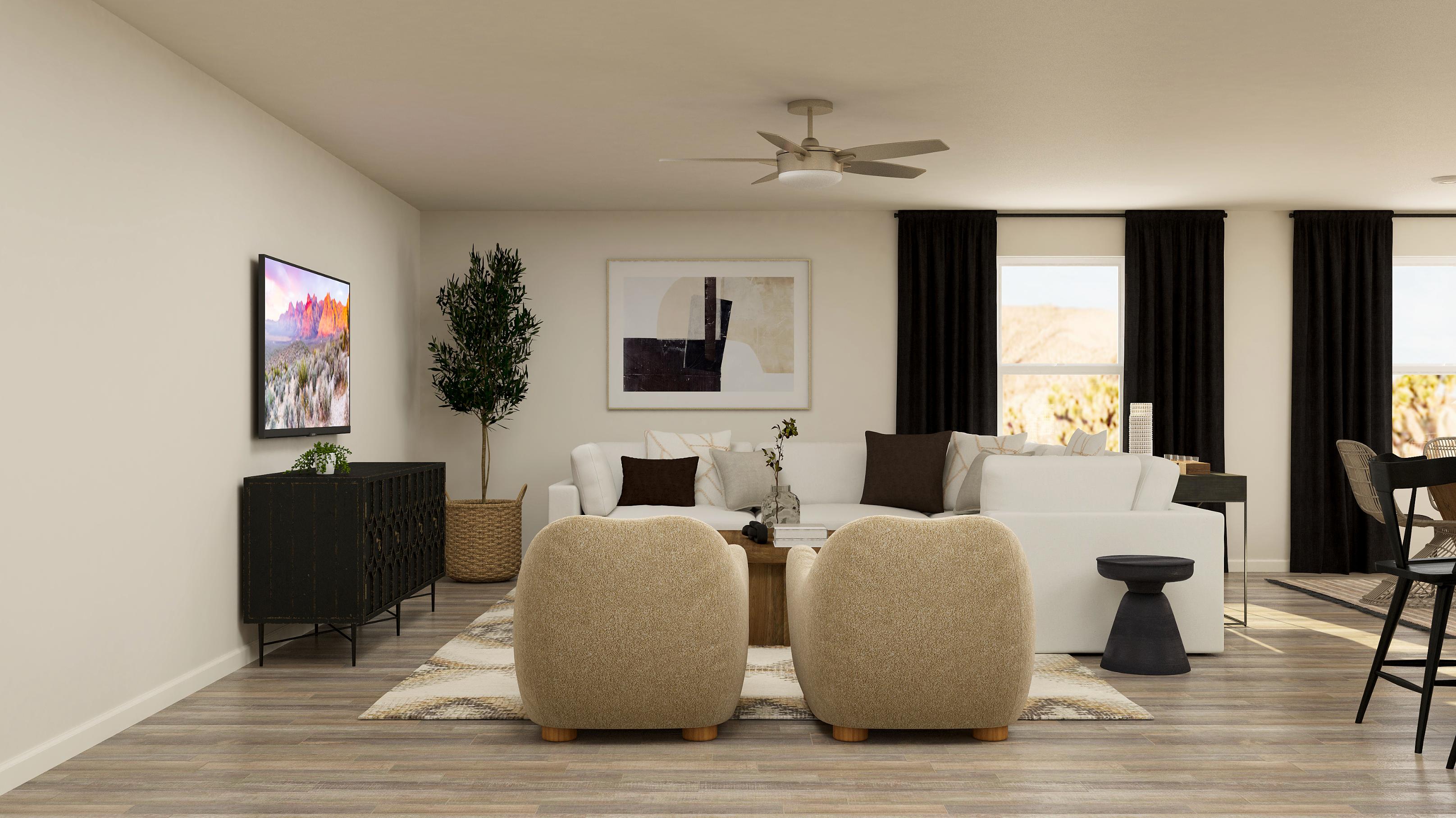 A living room with a white couch and a chandelier.
