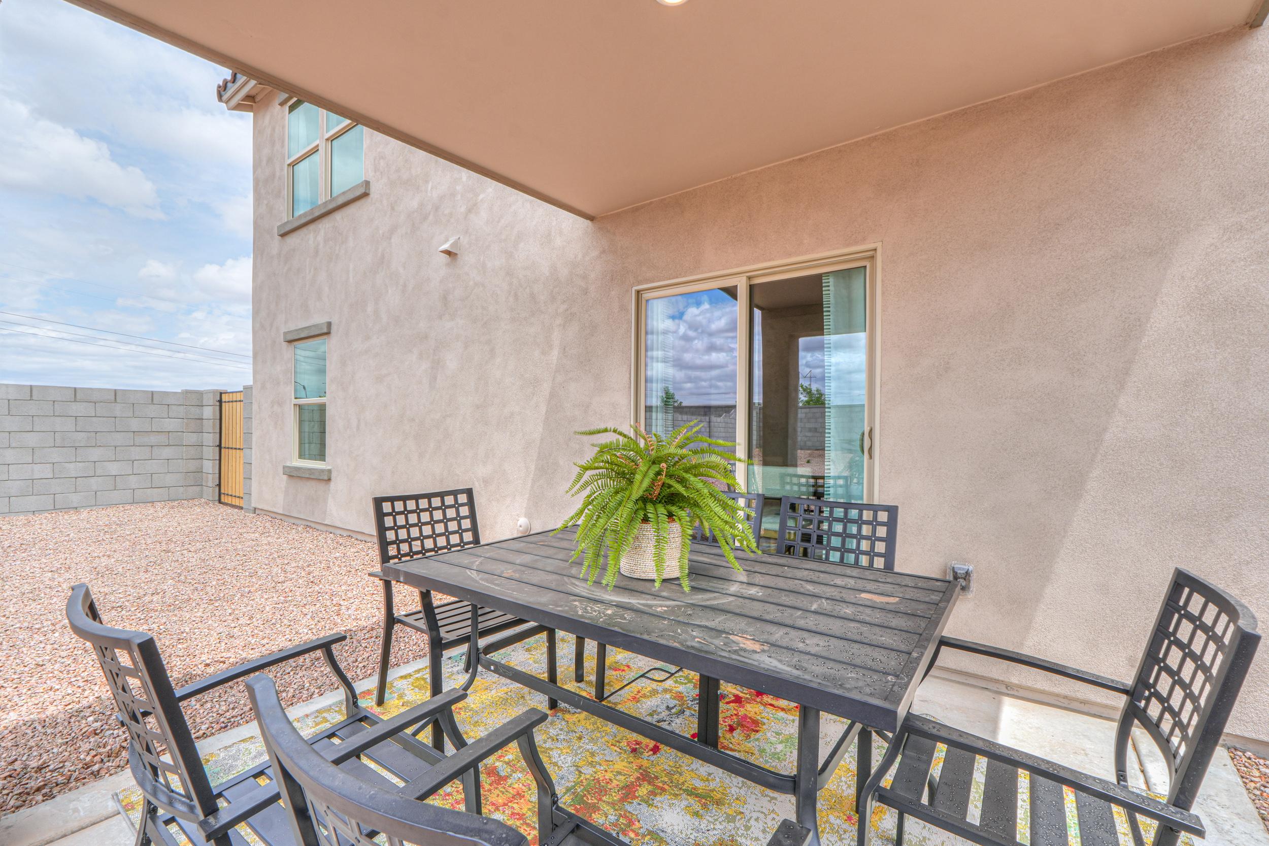 A table and chairs on a patio.