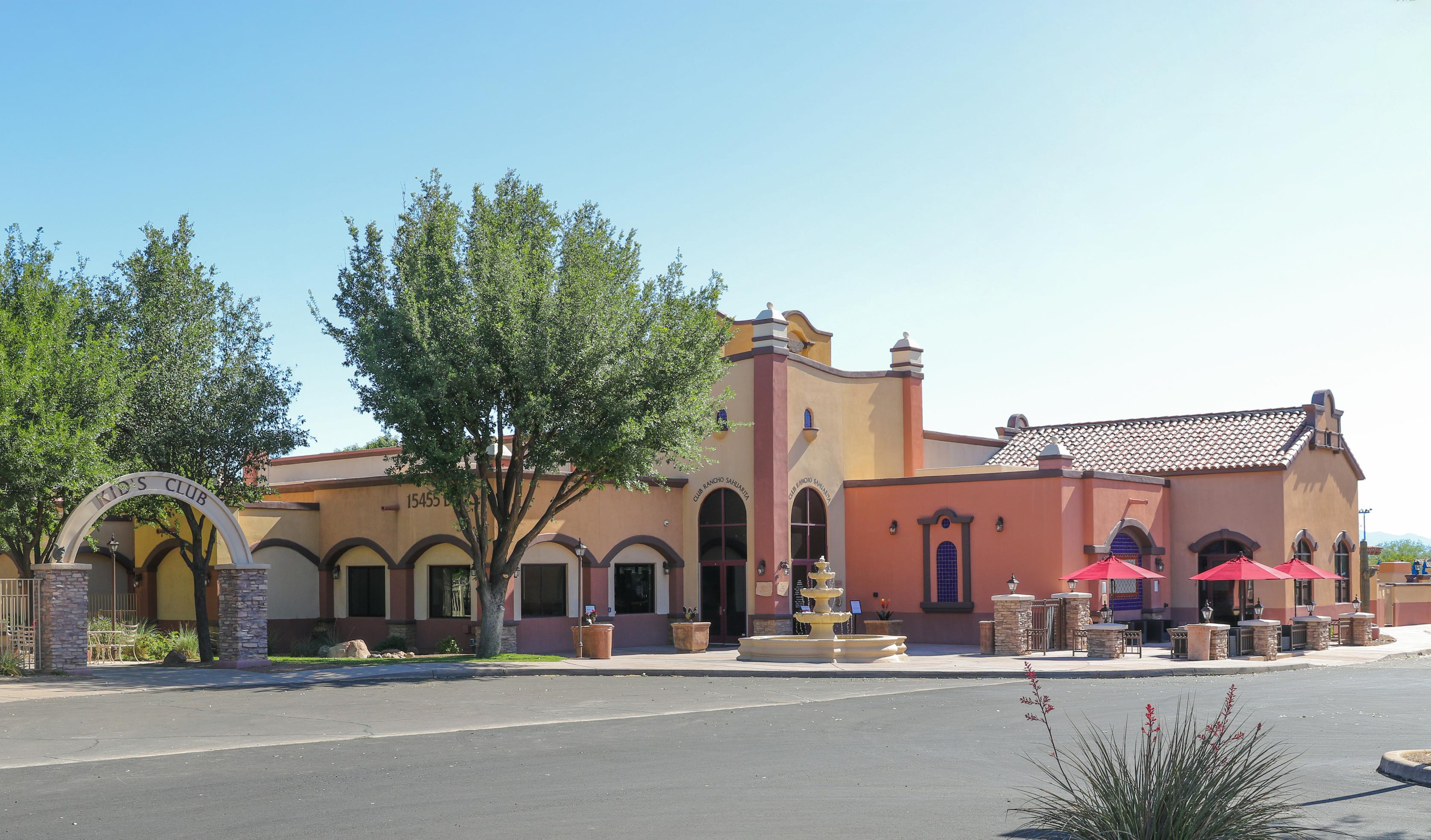 A large building with a tree in front of it.