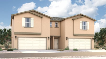 A house with garages and a driveway.