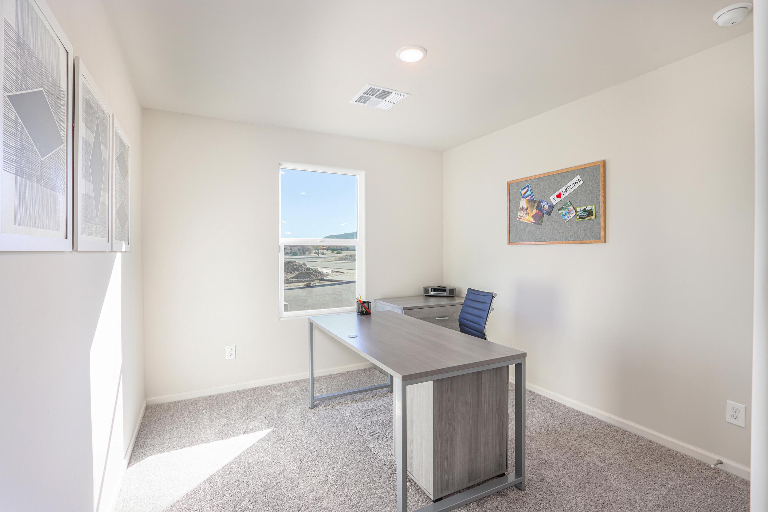 A room with a table and chairs.