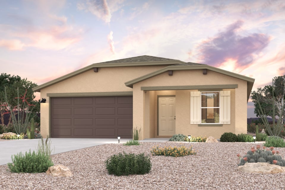 A house with a garage and bushes.