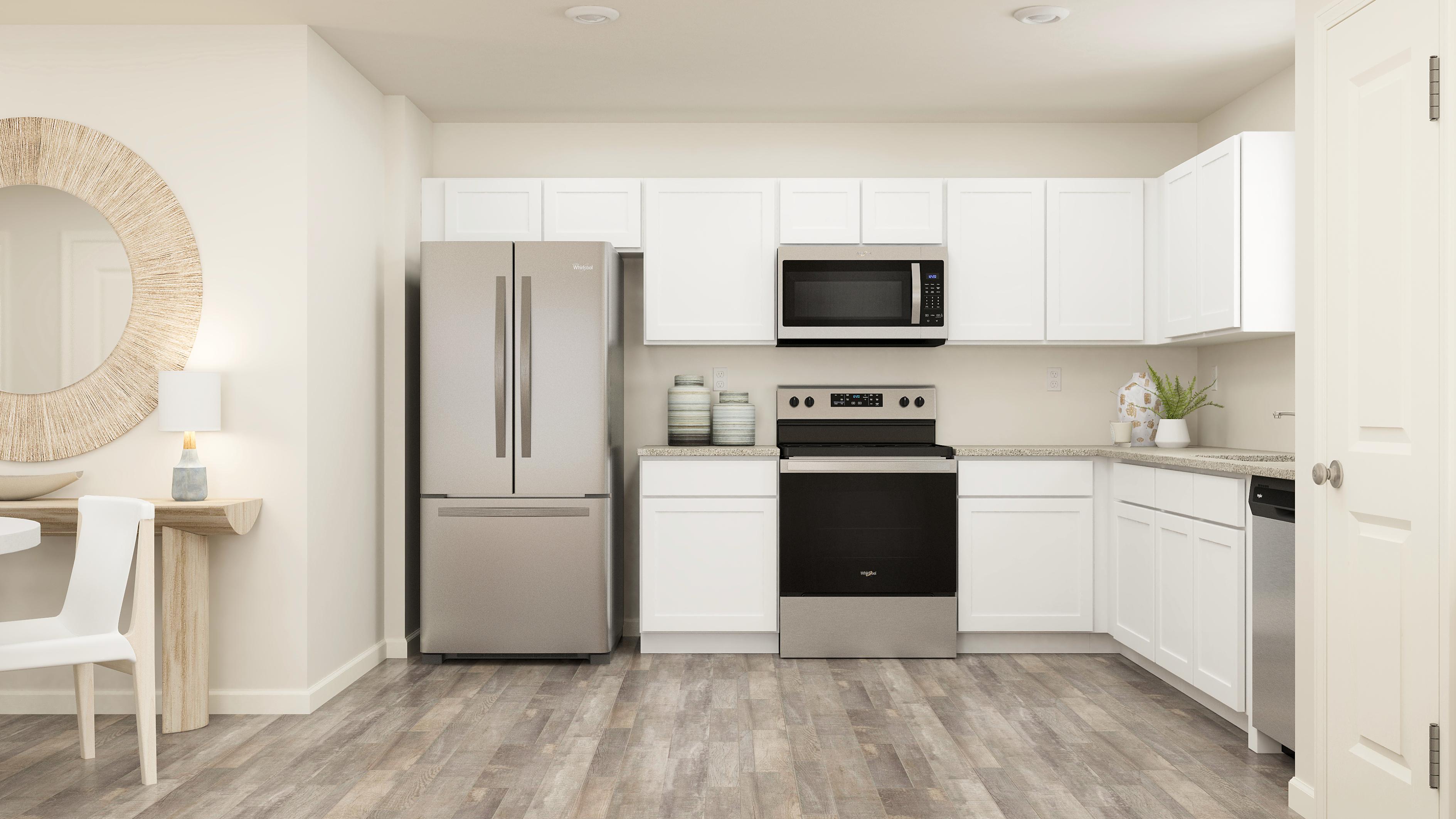 White cabinets and granite countertops in the kitchen.