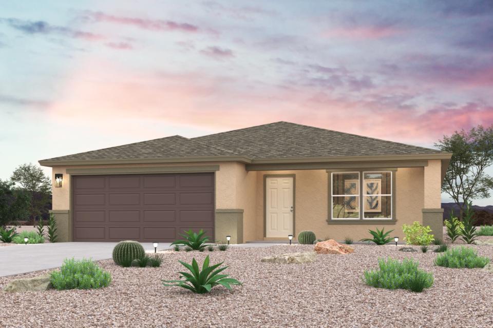 A house with a gravel driveway.