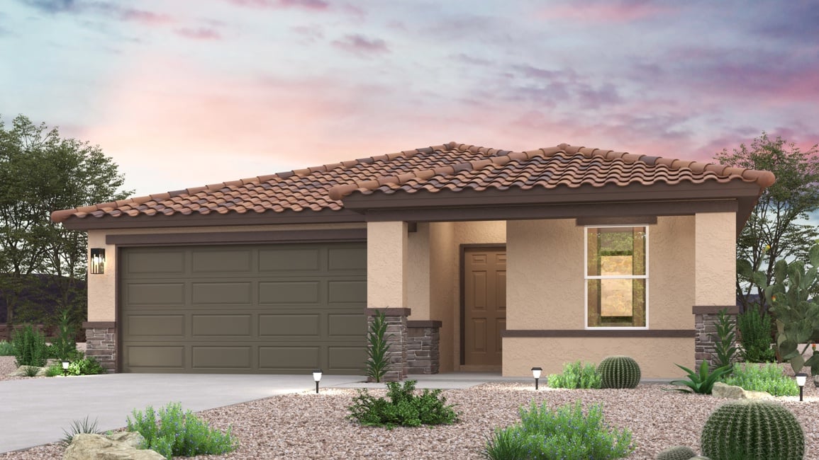 A house with a garage and bushes.