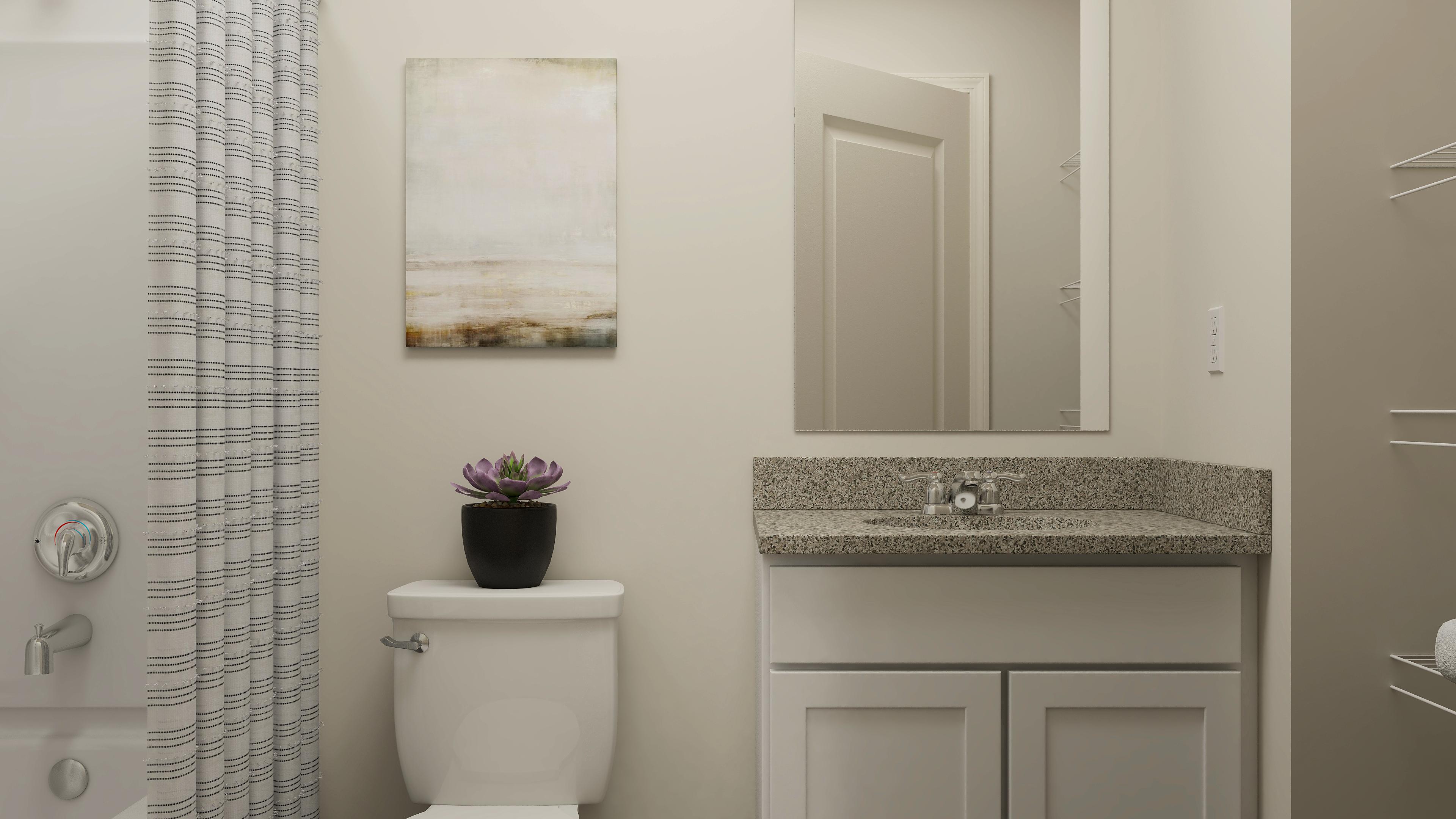 A bathroom with a sink and a toilet.