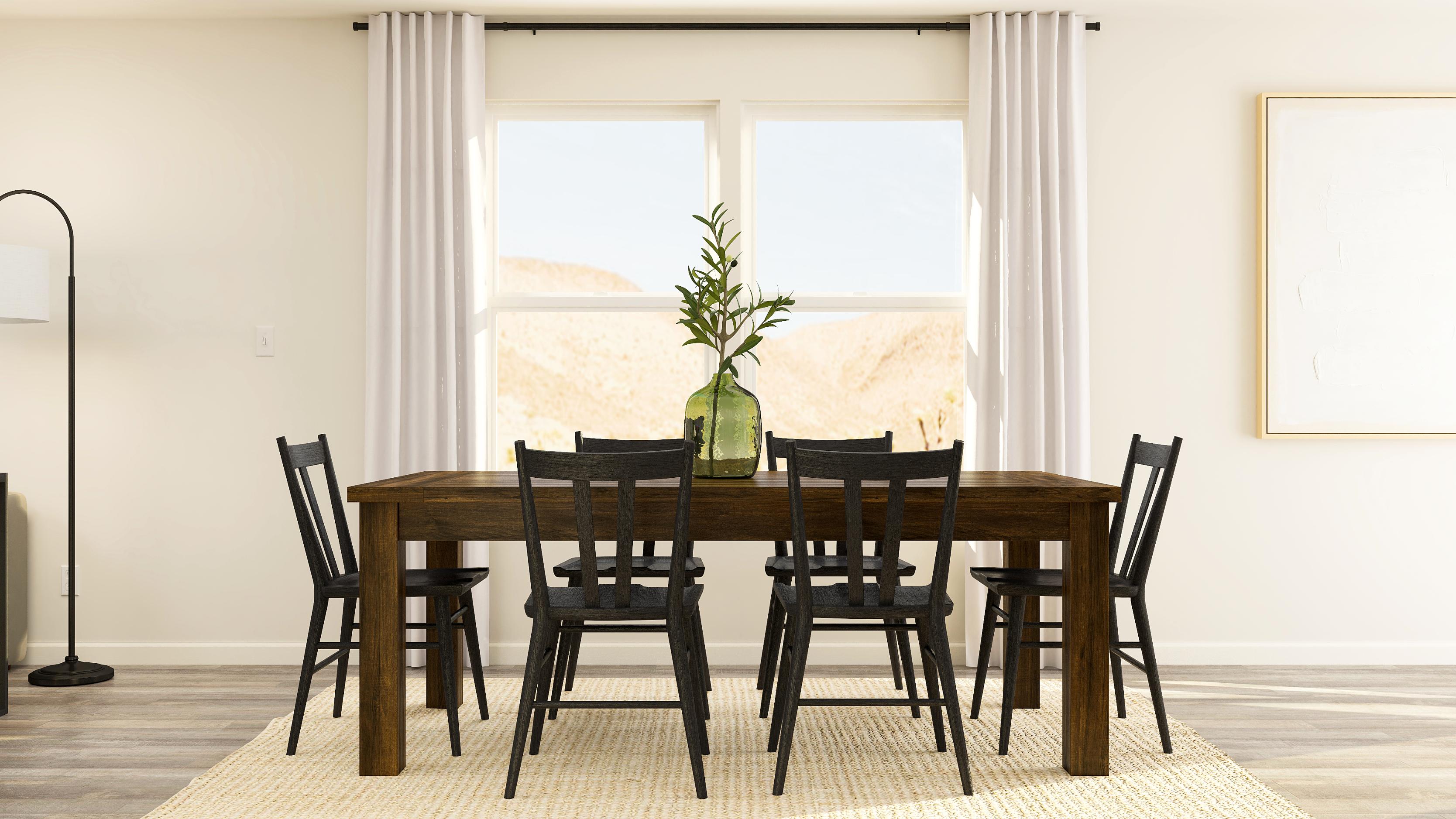 A dining table with chairs around it.