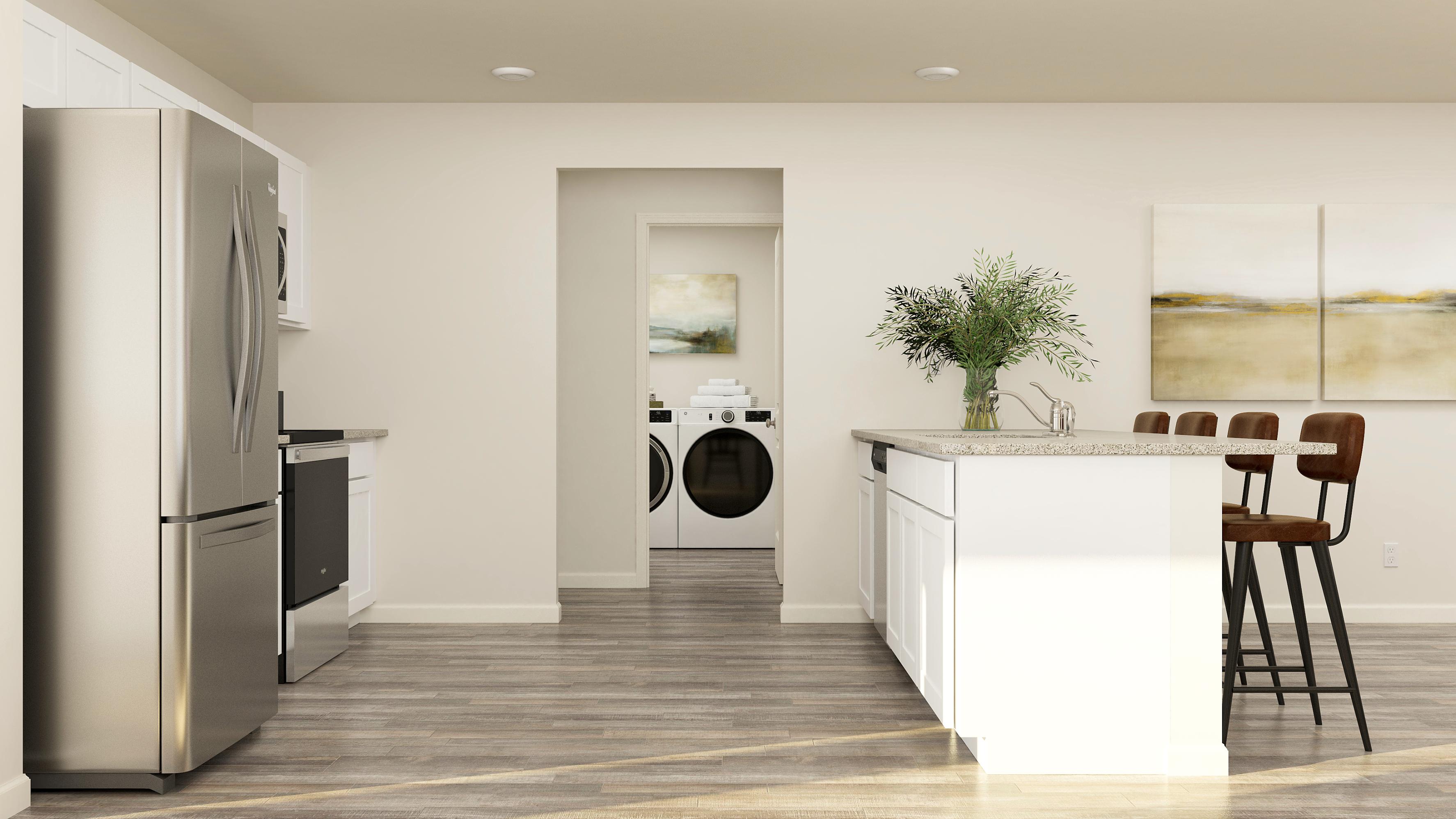 A kitchen with a table and chairs.
