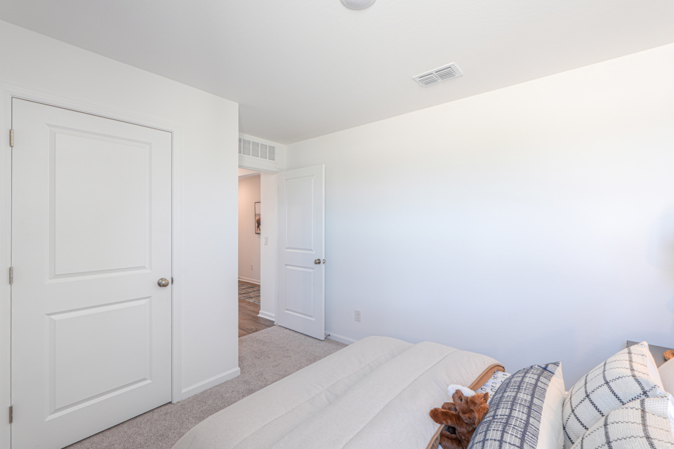 A room with white walls and a couch.