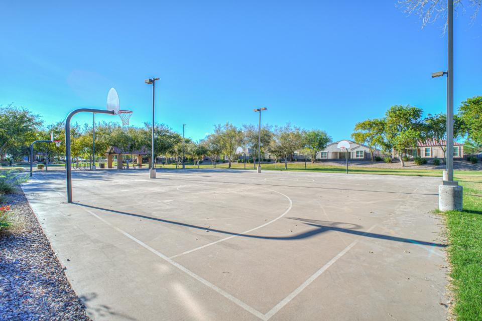 A basketball court with a basketball hoop.