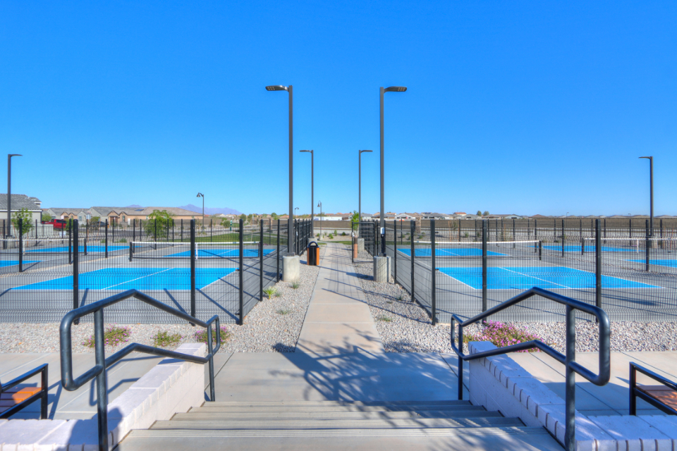 A walkway with railings and railings on a sunny day.
