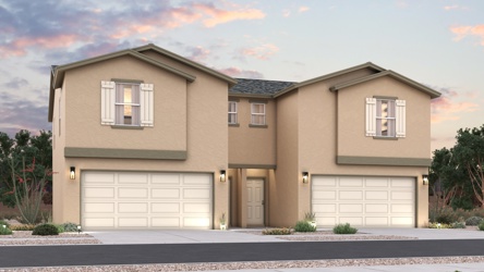 A house with garages and trees.