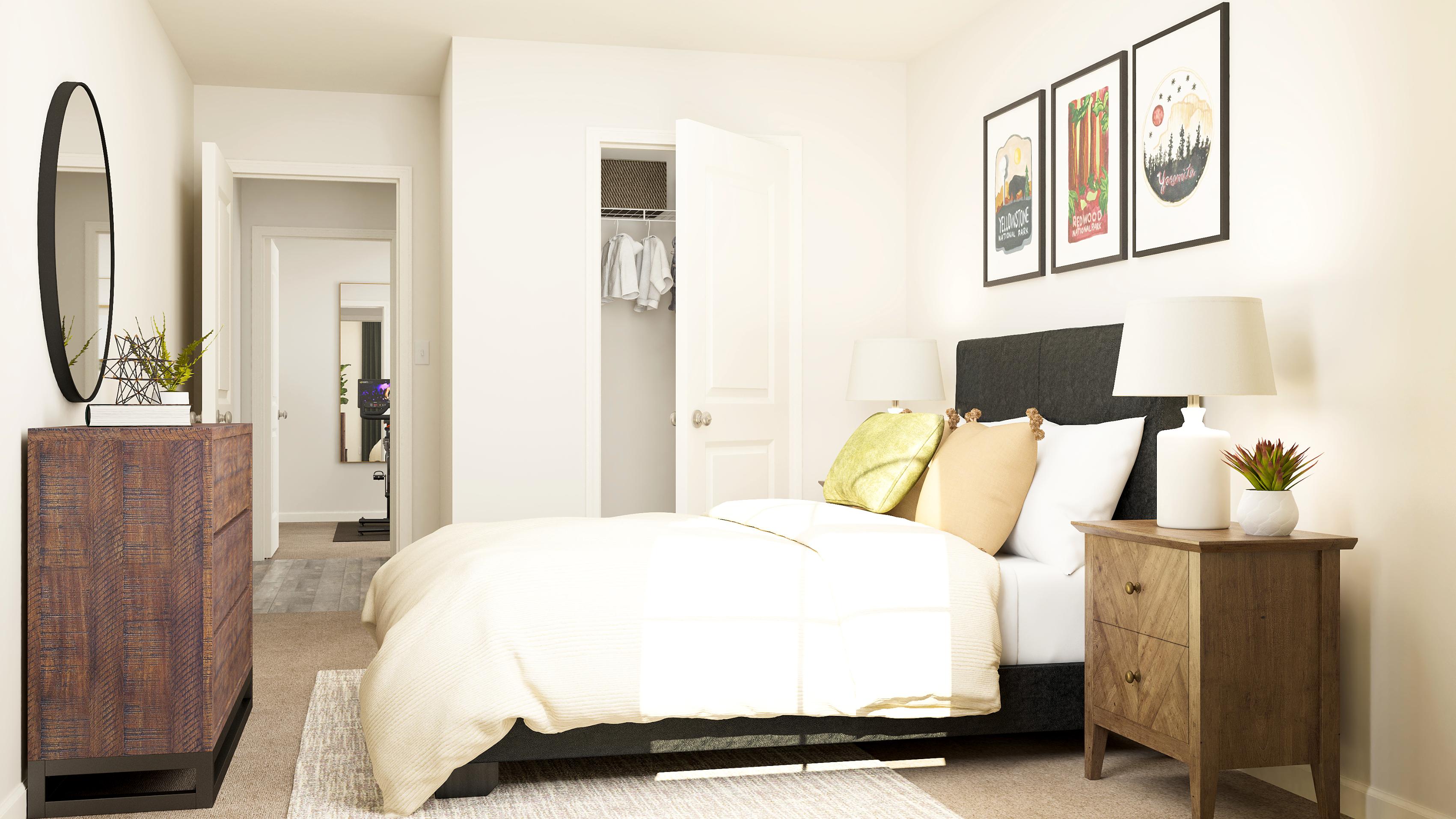 A bedroom with a bed and a dresser.