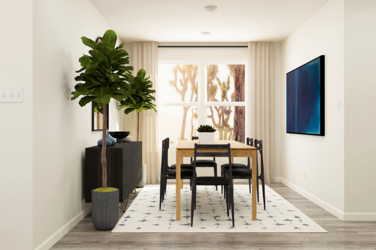 A dining room with a table and chairs.