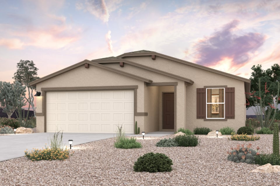 A house with a gravel driveway.