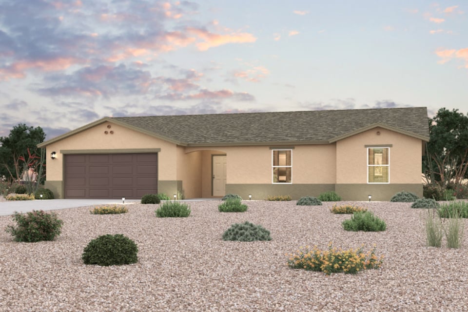 A house with a gravel driveway.
