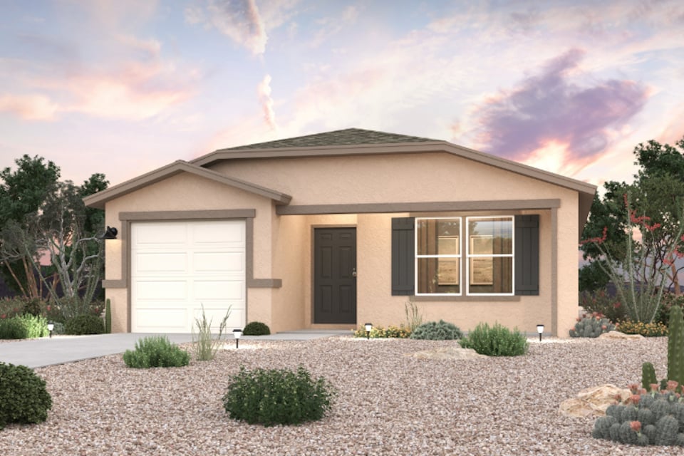A house with a gravel driveway.
