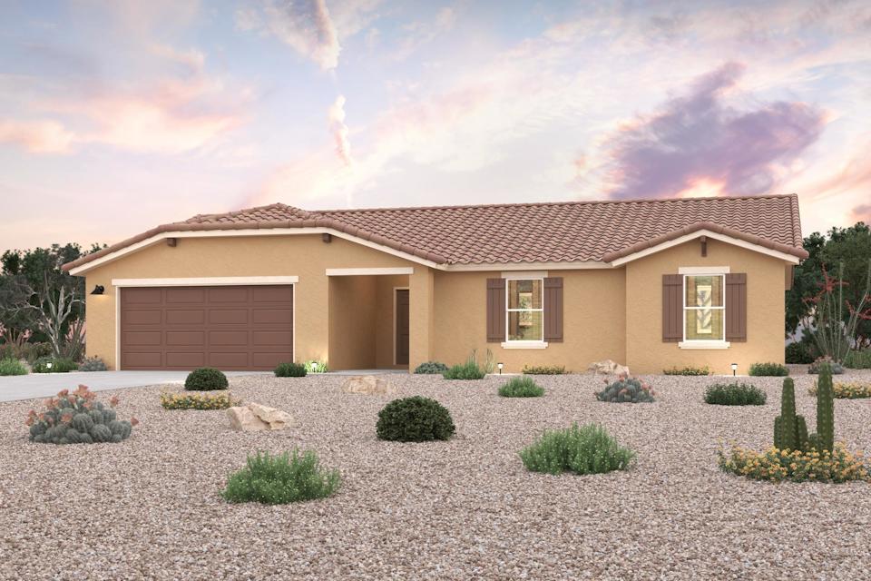 A house with a gravel driveway.