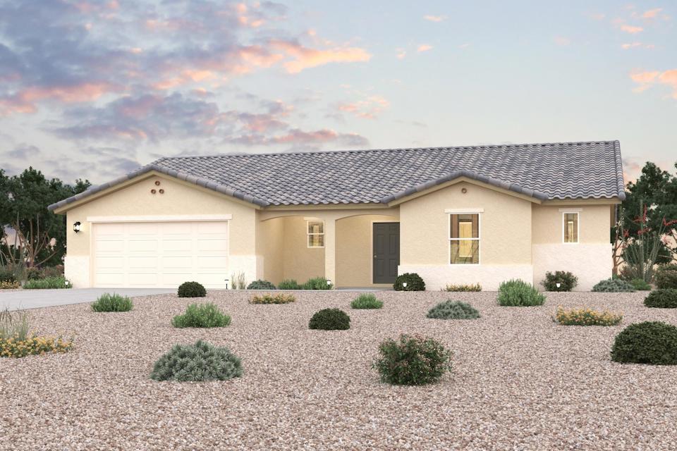 A house with a gravel driveway.