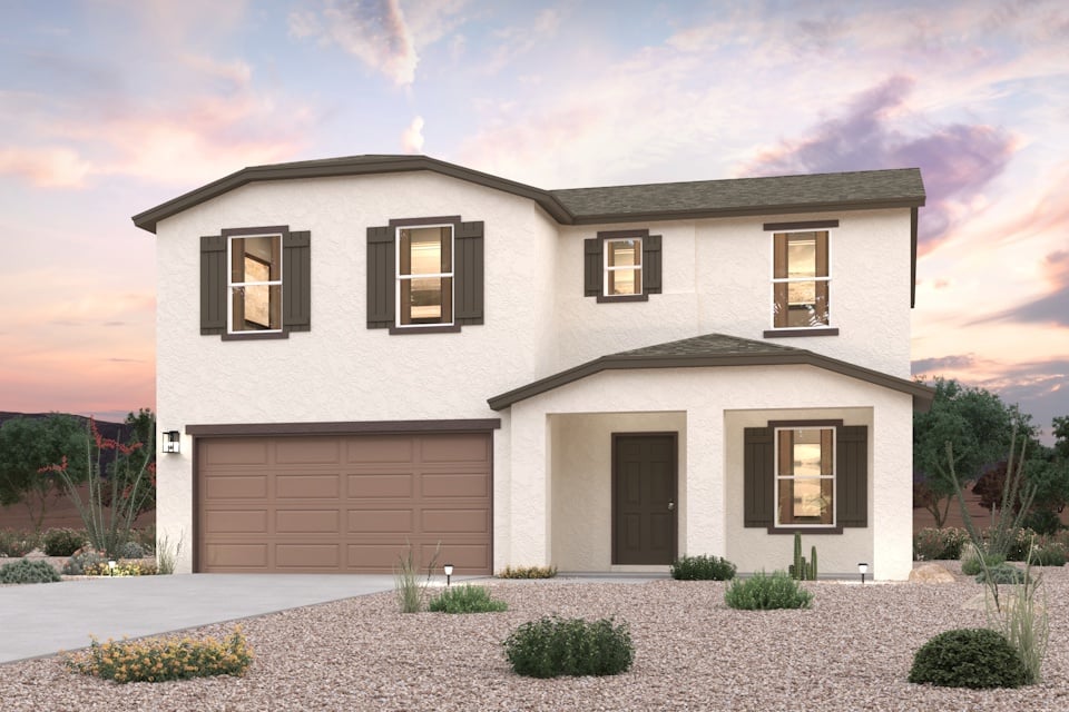 A white house with a garage.