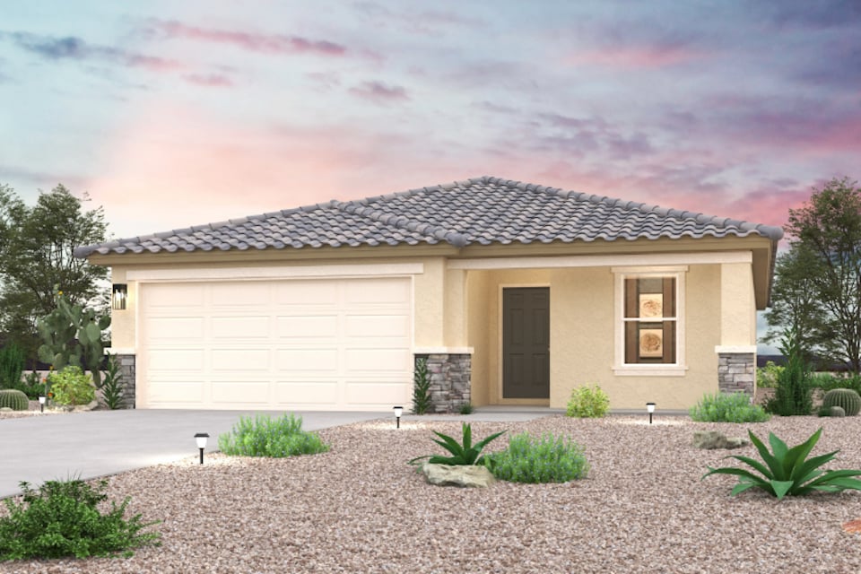 A house with a gravel driveway.