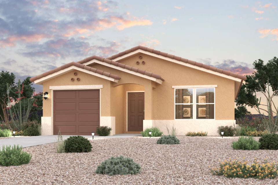 A house with a gravel driveway.