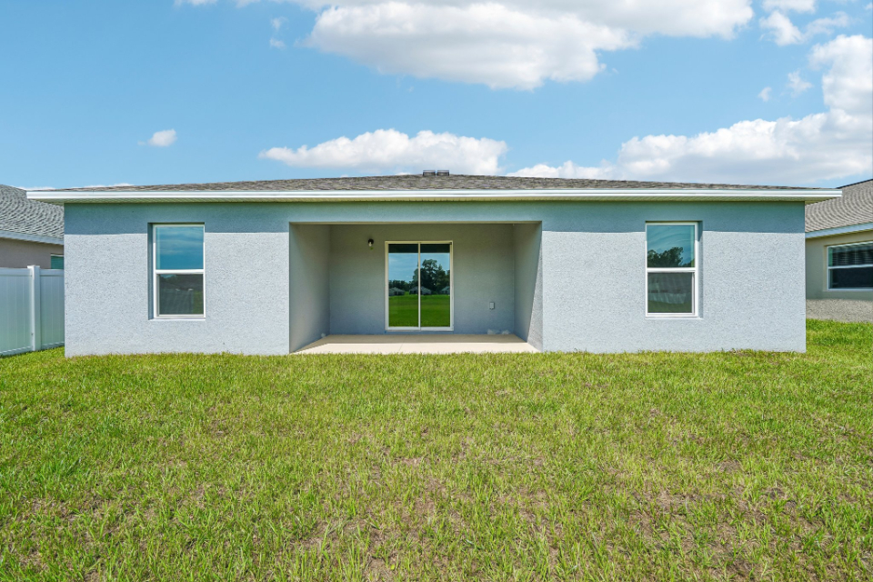 A house with a grass yard.