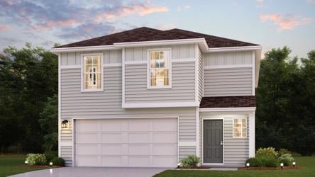 A white house with a garage.