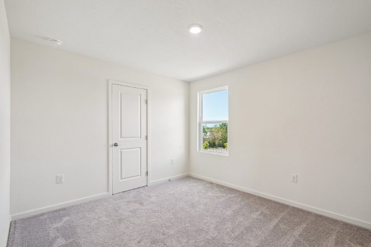 A room with a door and a window.