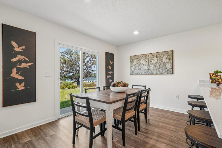 A dining room table with chairs.