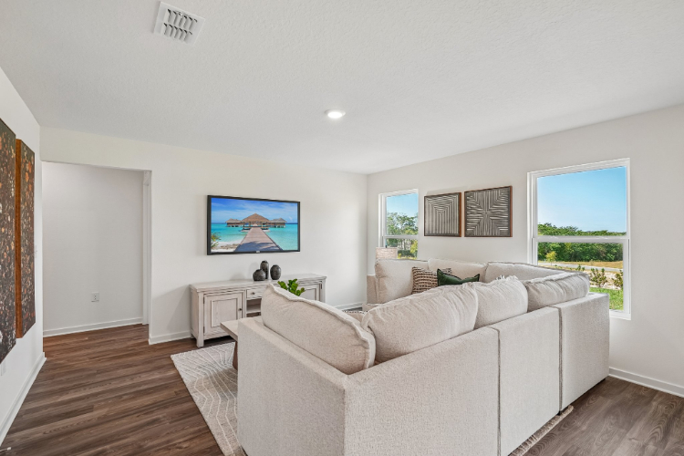 A living room with a white couch.