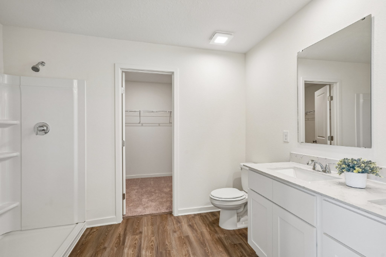 A bathroom with a toilet and sink.