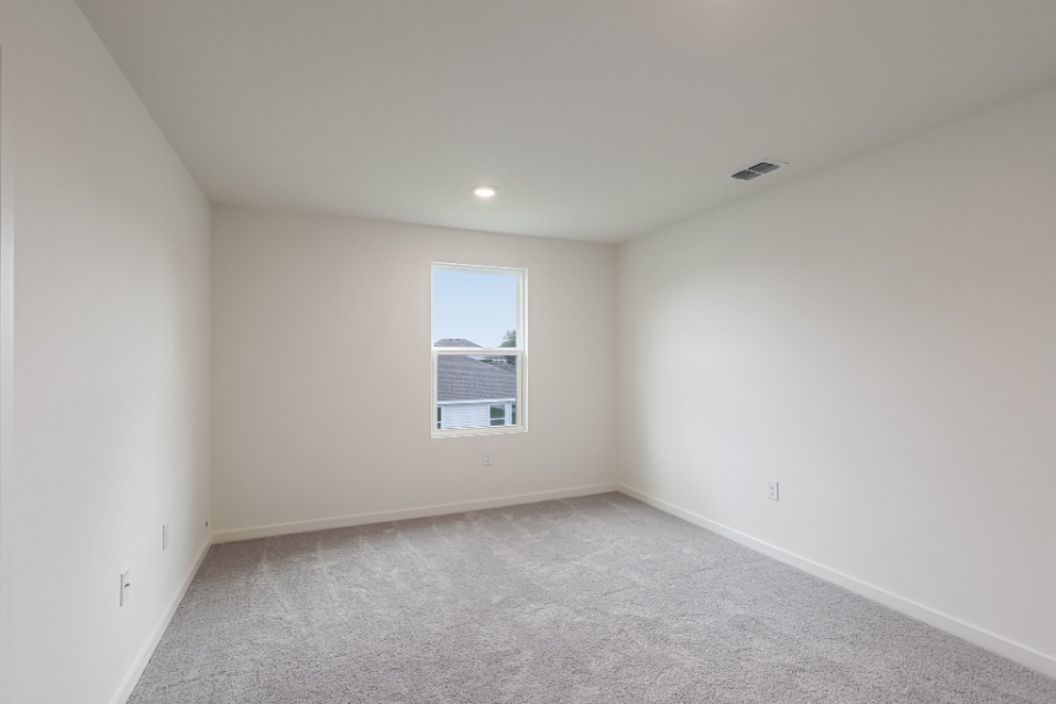 A room with a door and a window.