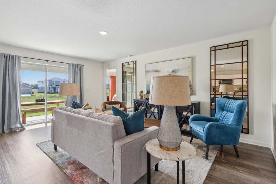 A living room with a couch and a table.