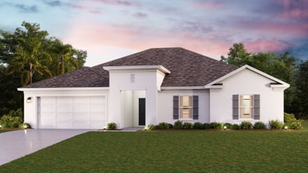 A white house with a green lawn.