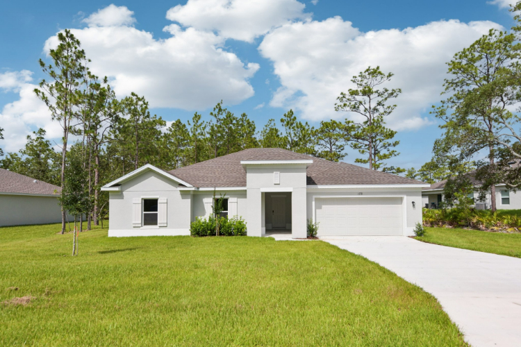 A white house with a driveway.
