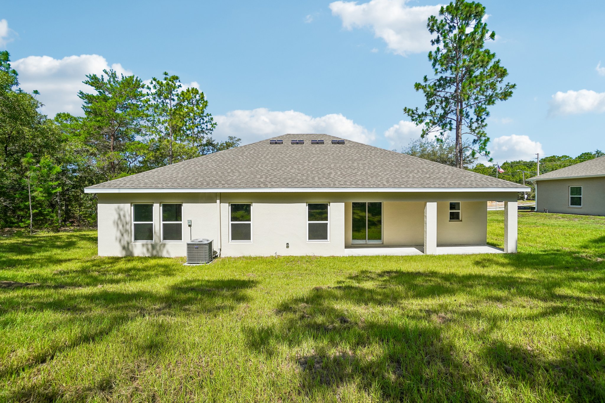 A house with a grass yard.