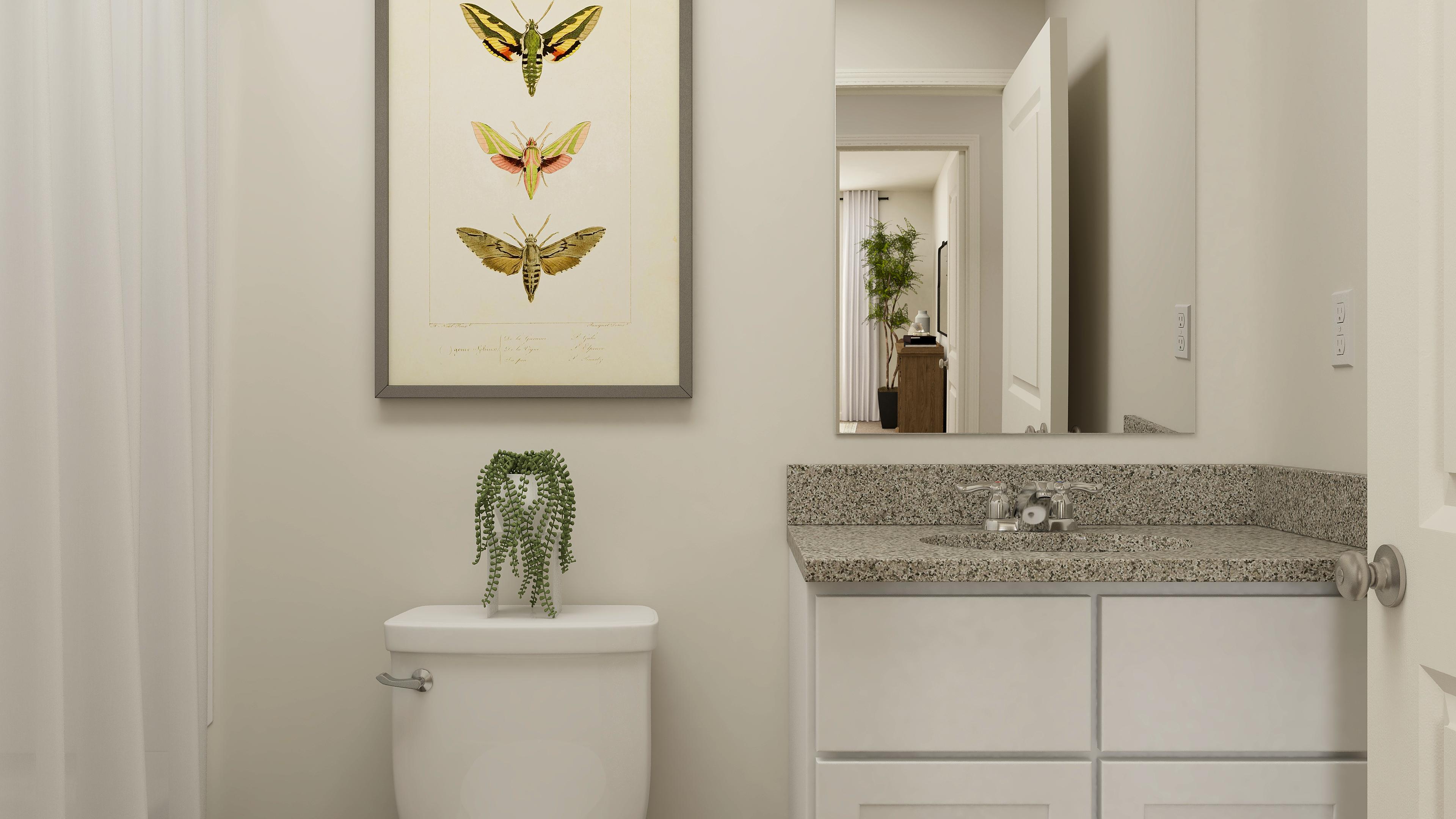 A bathroom with a sink and a mirror.