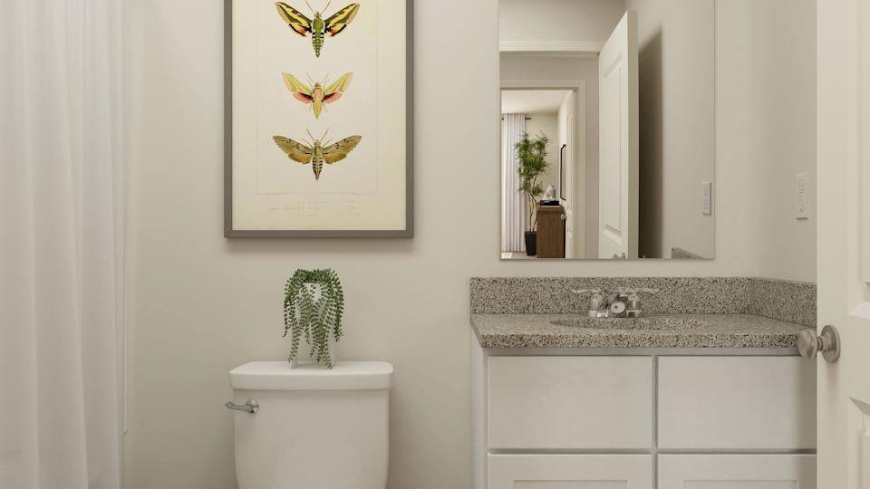A bathroom with a sink and a mirror.