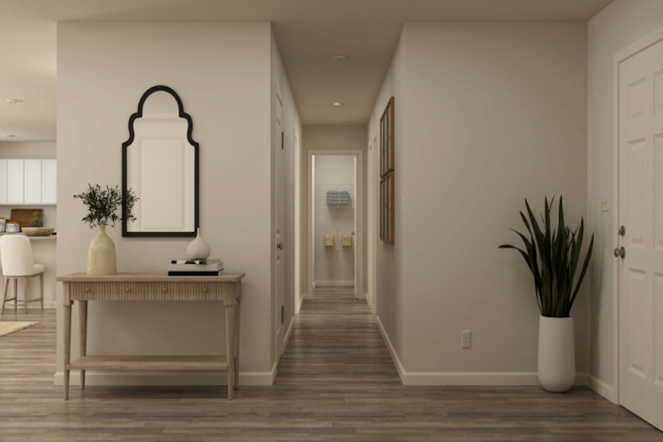 A room with a table and chairs.