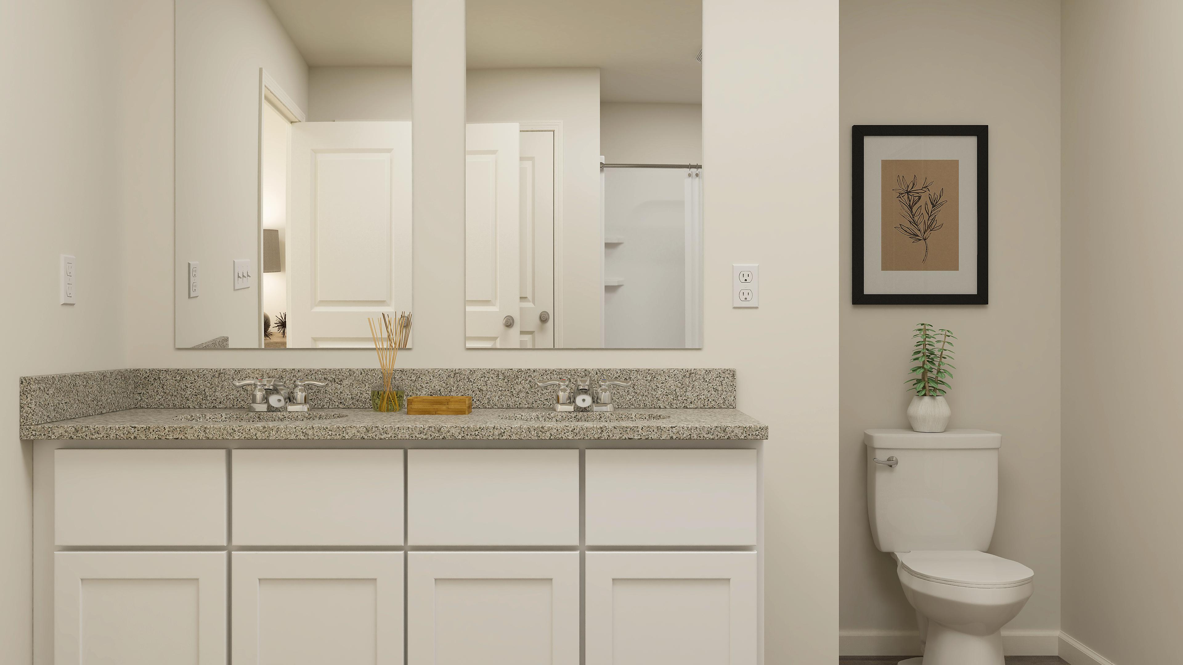 A bathroom with a marble countertop.