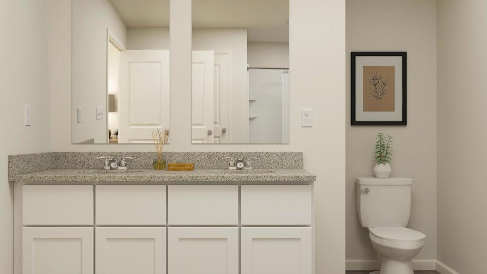 A bathroom with a marble countertop.