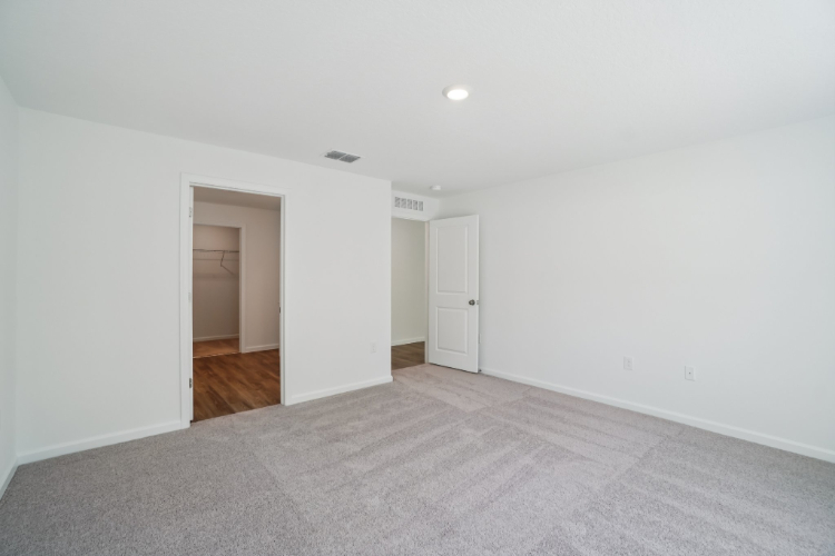 A hallway with white walls.
