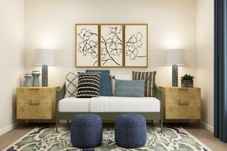 A couch with blue and white pillows.