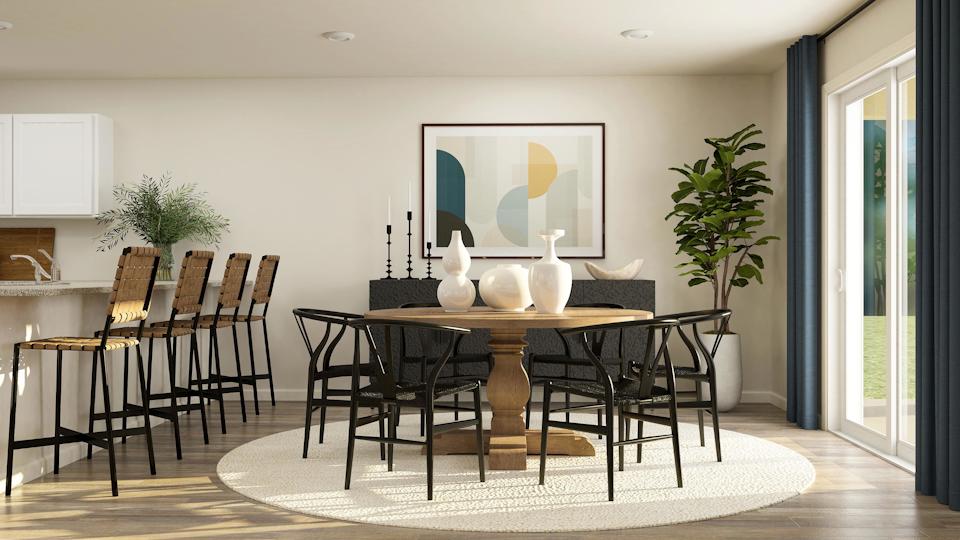 A dining room table with chairs.